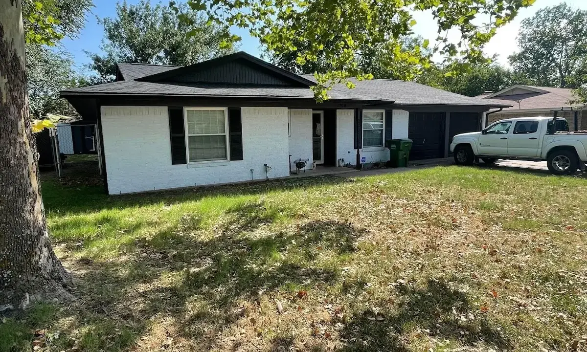 Professional roofing crew working on a residential roof in Lantana